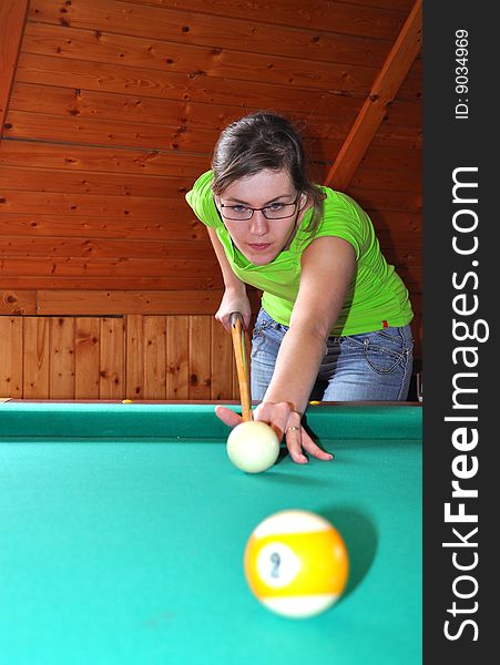 Beautiful woman playing billiard, ready to shot. Beautiful woman playing billiard, ready to shot