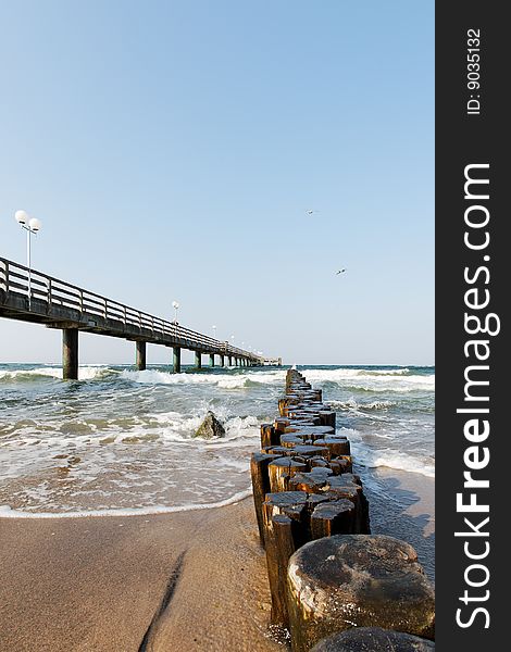 Windy beach with sea bridge baltic sea