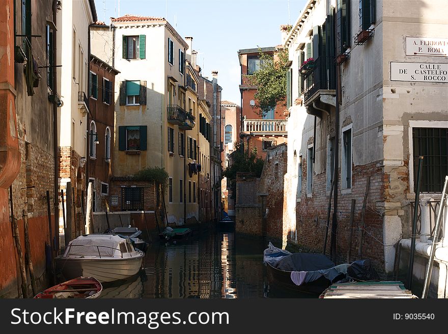 Photo of a typical canal in Venice. Photo of a typical canal in Venice