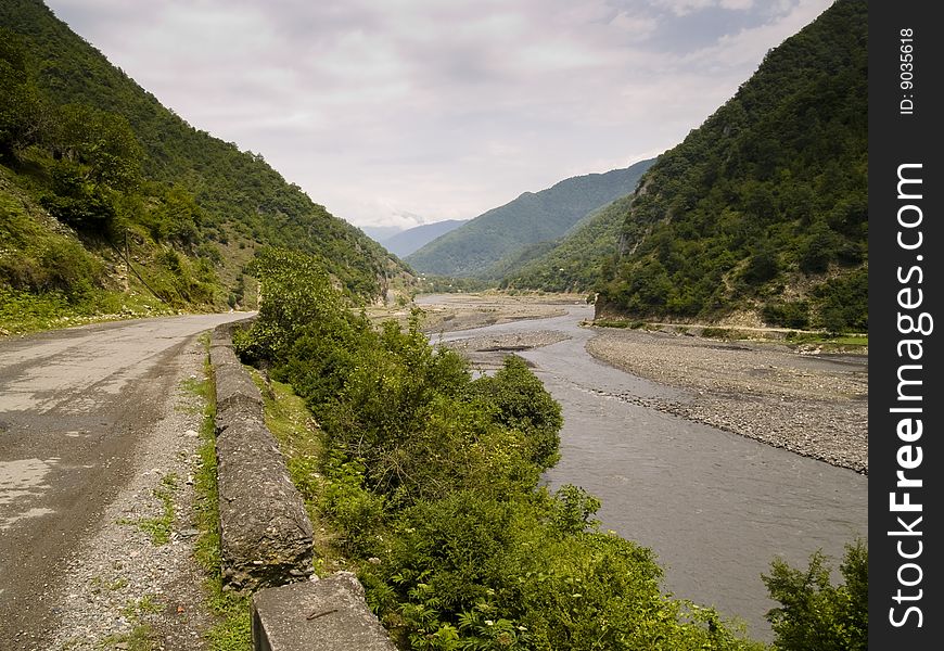 Small asphalt route and river in mounatin - Caucas Georgia. Small asphalt route and river in mounatin - Caucas Georgia