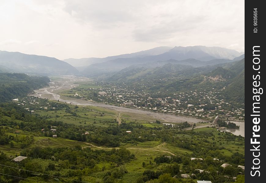 Big green valley in Georgia, Caucas. Cloudy day.