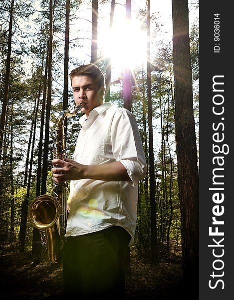 Saxy men player on saxophone. Saxy men player on saxophone