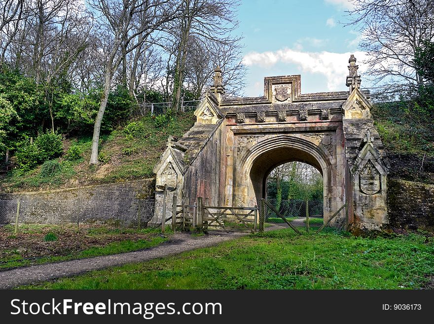 Peaceful walk leading to archway under old railway bridge. Peaceful walk leading to archway under old railway bridge