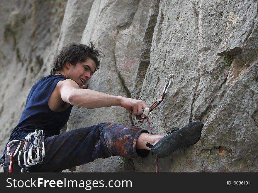 Climber in action on limestone rock