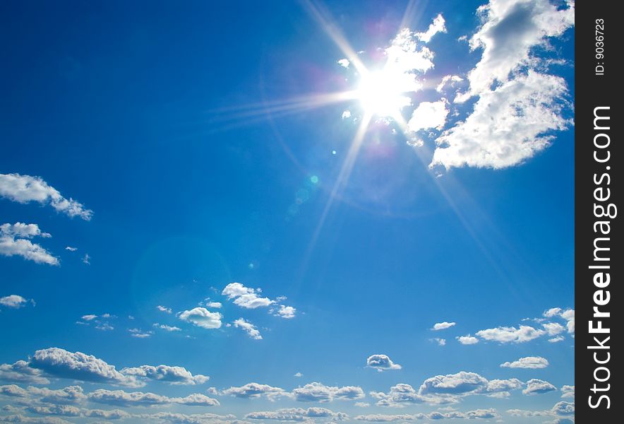 White clouds in a blue sky as background. White clouds in a blue sky as background