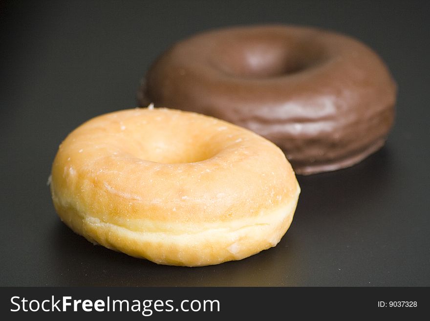 Breakfast glass of chocolate milk and donut isolated