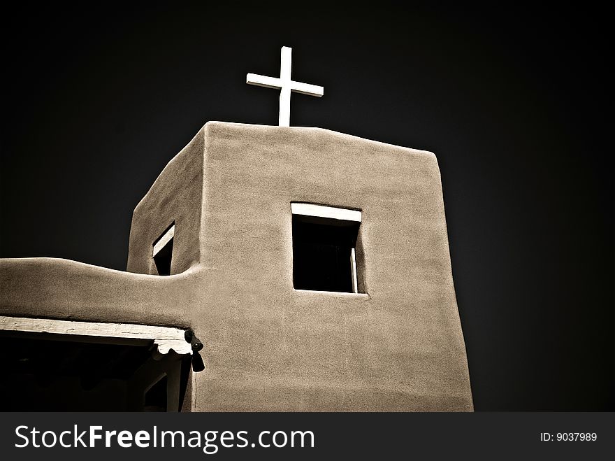 Partial view of adobe church in New Mexico. Dark cross-processed image. Partial view of adobe church in New Mexico. Dark cross-processed image