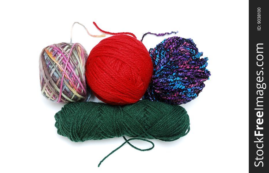 3 balls of colorful yarn above horizontal yarn. 3 balls of colorful yarn above horizontal yarn