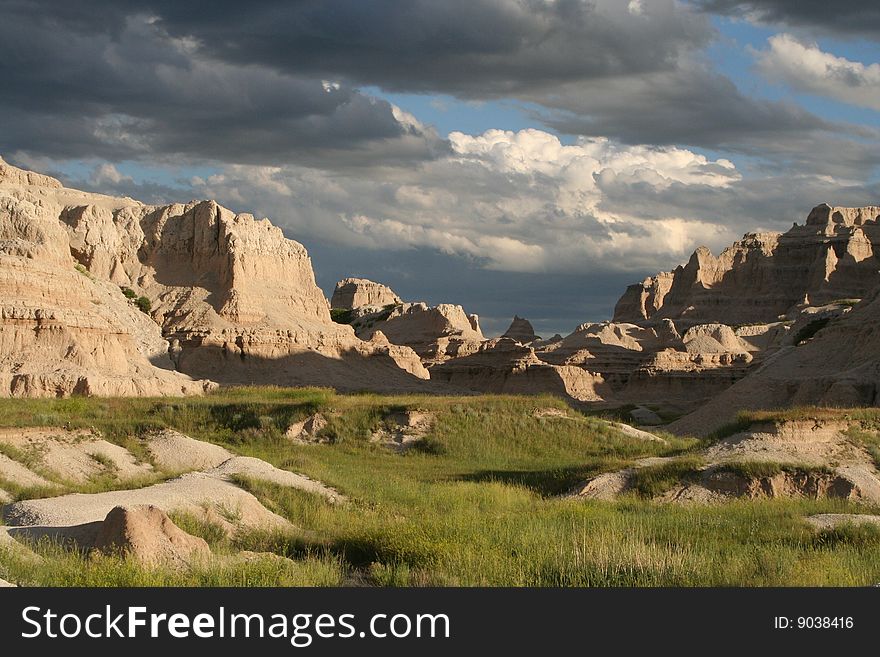 The Badlands are bright lit as a storm begins to roll in. The Badlands are bright lit as a storm begins to roll in.