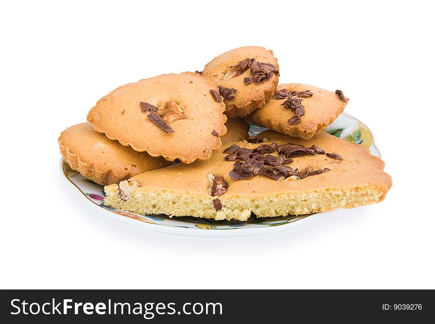 Biscuits with nuts and chocolate on a plate