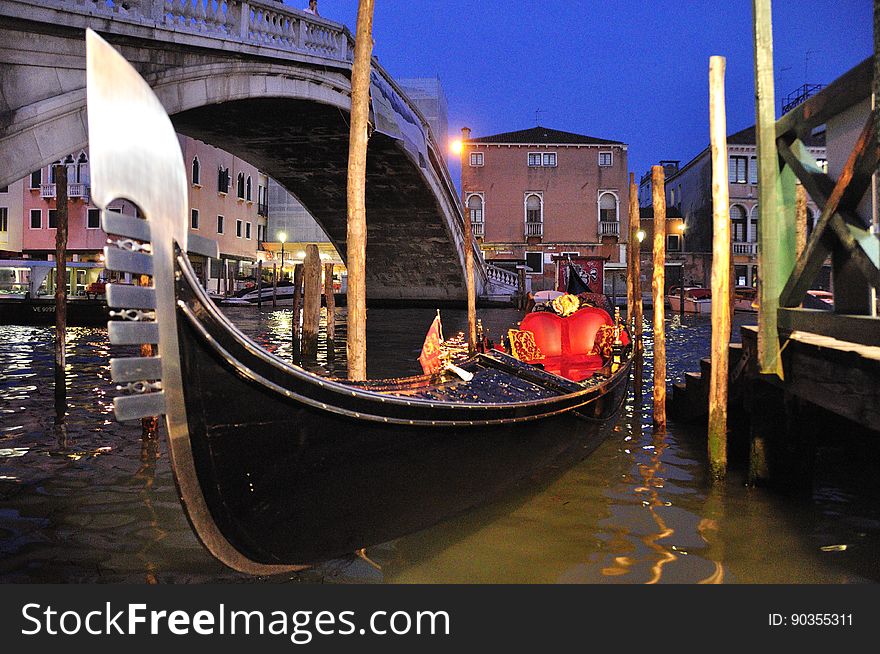 The water streets of Venice are canals which are navigated by gondolas and other small boats. During daylight hours the canals, bridges, and streets of Venice are full of tourists eager to experience the romance of this great travel destination. As night engulfs the town, tourists enjoy some fine dining at one of the many restaurants, leaving the waterways and streets quiet. The gondola is a traditional, flat-bottomed Venetian rowing boat, well suited to the conditions of the Venetian Lagoon. For centuries gondolas were once the chief means of transportation and most common watercraft within Venice. In modern times the iconic boats still have a role in public transport in the city, serving as ferries over the Grand Canal. They are also used in special regattas &#x28;rowing races&#x29; held amongst gondoliers. Their main role, however, is to carry tourists on rides throughout the canals. Gondolas are hand made using 8 different types of wood &#x28;fir, oak, cherry, walnut, elm, mahogany, larch and lime&#x29; and are composed of 280 pieces. The oars are made of beech wood. The left side of the gondola is longer than the right side. This asymmetry causes the gondola to resist the tendency to turn toward the left at the forward stroke. Venetian masks are a centuries-old tradition of Venice. The masks are typically worn during the Carnival of Venice, but have been used on many other occasions in the past, usually as a device for hiding the wearer&#x27;s identity and social status. The mask would permit the wearer to act more freely in cases where he or she wanted to interact with other members of the society outside the bounds of identity and everyday convention. It was thus useful for a variety of purposes, some of them illicit or criminal, others just personal, such as romantic encounters. The water streets of Venice are canals which are navigated by gondolas and other small boats. During daylight hours the canals, bridges, and streets of Venice are full of tourists eager to experience the romance of this great travel destination. As night engulfs the town, tourists enjoy some fine dining at one of the many restaurants, leaving the waterways and streets quiet. The gondola is a traditional, flat-bottomed Venetian rowing boat, well suited to the conditions of the Venetian Lagoon. For centuries gondolas were once the chief means of transportation and most common watercraft within Venice. In modern times the iconic boats still have a role in public transport in the city, serving as ferries over the Grand Canal. They are also used in special regattas &#x28;rowing races&#x29; held amongst gondoliers. Their main role, however, is to carry tourists on rides throughout the canals. Gondolas are hand made using 8 different types of wood &#x28;fir, oak, cherry, walnut, elm, mahogany, larch and lime&#x29; and are composed of 280 pieces. The oars are made of beech wood. The left side of the gondola is longer than the right side. This asymmetry causes the gondola to resist the tendency to turn toward the left at the forward stroke. Venetian masks are a centuries-old tradition of Venice. The masks are typically worn during the Carnival of Venice, but have been used on many other occasions in the past, usually as a device for hiding the wearer&#x27;s identity and social status. The mask would permit the wearer to act more freely in cases where he or she wanted to interact with other members of the society outside the bounds of identity and everyday convention. It was thus useful for a variety of purposes, some of them illicit or criminal, others just personal, such as romantic encounters.