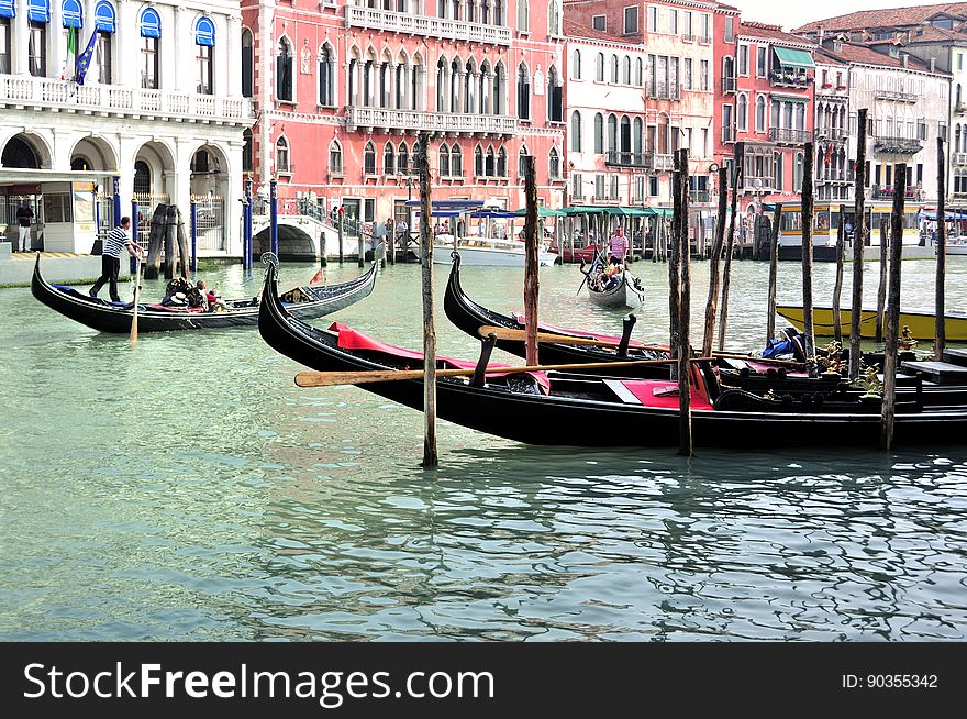 The water streets of Venice are canals which are navigated by gondolas and other small boats. During daylight hours the canals, bridges, and streets of Venice are full of tourists eager to experience the romance of this great travel destination. As night engulfs the town, tourists enjoy some fine dining at one of the many restaurants, leaving the waterways and streets quiet. The gondola is a traditional, flat-bottomed Venetian rowing boat, well suited to the conditions of the Venetian Lagoon. For centuries gondolas were once the chief means of transportation and most common watercraft within Venice. In modern times the iconic boats still have a role in public transport in the city, serving as ferries over the Grand Canal. They are also used in special regattas &#x28;rowing races&#x29; held amongst gondoliers. Their main role, however, is to carry tourists on rides throughout the canals. Gondolas are hand made using 8 different types of wood &#x28;fir, oak, cherry, walnut, elm, mahogany, larch and lime&#x29; and are composed of 280 pieces. The oars are made of beech wood. The left side of the gondola is longer than the right side. This asymmetry causes the gondola to resist the tendency to turn toward the left at the forward stroke. The water streets of Venice are canals which are navigated by gondolas and other small boats. During daylight hours the canals, bridges, and streets of Venice are full of tourists eager to experience the romance of this great travel destination. As night engulfs the town, tourists enjoy some fine dining at one of the many restaurants, leaving the waterways and streets quiet. The gondola is a traditional, flat-bottomed Venetian rowing boat, well suited to the conditions of the Venetian Lagoon. For centuries gondolas were once the chief means of transportation and most common watercraft within Venice. In modern times the iconic boats still have a role in public transport in the city, serving as ferries over the Grand Canal. They are also used in special regattas &#x28;rowing races&#x29; held amongst gondoliers. Their main role, however, is to carry tourists on rides throughout the canals. Gondolas are hand made using 8 different types of wood &#x28;fir, oak, cherry, walnut, elm, mahogany, larch and lime&#x29; and are composed of 280 pieces. The oars are made of beech wood. The left side of the gondola is longer than the right side. This asymmetry causes the gondola to resist the tendency to turn toward the left at the forward stroke.