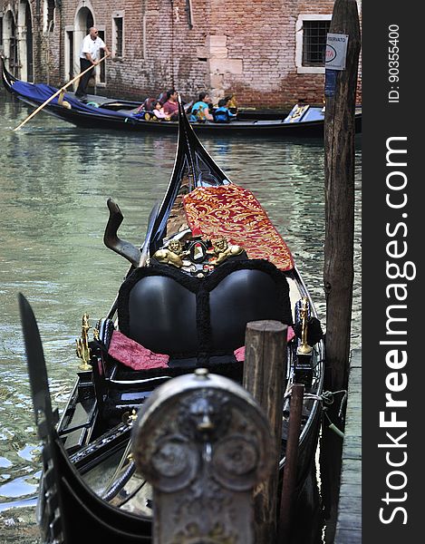 The water streets of Venice are canals which are navigated by gondolas and other small boats. During daylight hours the canals, bridges, and streets of Venice are full of tourists eager to experience the romance of this great travel destination. As night engulfs the town, tourists enjoy some fine dining at one of the many restaurants, leaving the waterways and streets quiet. The gondola is a traditional, flat-bottomed Venetian rowing boat, well suited to the conditions of the Venetian Lagoon. For centuries gondolas were once the chief means of transportation and most common watercraft within Venice. In modern times the iconic boats still have a role in public transport in the city, serving as ferries over the Grand Canal. They are also used in special regattas &#x28;rowing races&#x29; held amongst gondoliers. Their main role, however, is to carry tourists on rides throughout the canals. Gondolas are hand made using 8 different types of wood &#x28;fir, oak, cherry, walnut, elm, mahogany, larch and lime&#x29; and are composed of 280 pieces. The oars are made of beech wood. The left side of the gondola is longer than the right side. This asymmetry causes the gondola to resist the tendency to turn toward the left at the forward stroke. Venetian masks are a centuries-old tradition of Venice. The masks are typically worn during the Carnival of Venice, but have been used on many other occasions in the past, usually as a device for hiding the wearer&#x27;s identity and social status. The mask would permit the wearer to act more freely in cases where he or she wanted to interact with other members of the society outside the bounds of identity and everyday convention. It was thus useful for a variety of purposes, some of them illicit or criminal, others just personal, such as romantic encounters. The water streets of Venice are canals which are navigated by gondolas and other small boats. During daylight hours the canals, bridges, and streets of Venice are full of tourists eager to experience the romance of this great travel destination. As night engulfs the town, tourists enjoy some fine dining at one of the many restaurants, leaving the waterways and streets quiet. The gondola is a traditional, flat-bottomed Venetian rowing boat, well suited to the conditions of the Venetian Lagoon. For centuries gondolas were once the chief means of transportation and most common watercraft within Venice. In modern times the iconic boats still have a role in public transport in the city, serving as ferries over the Grand Canal. They are also used in special regattas &#x28;rowing races&#x29; held amongst gondoliers. Their main role, however, is to carry tourists on rides throughout the canals. Gondolas are hand made using 8 different types of wood &#x28;fir, oak, cherry, walnut, elm, mahogany, larch and lime&#x29; and are composed of 280 pieces. The oars are made of beech wood. The left side of the gondola is longer than the right side. This asymmetry causes the gondola to resist the tendency to turn toward the left at the forward stroke. Venetian masks are a centuries-old tradition of Venice. The masks are typically worn during the Carnival of Venice, but have been used on many other occasions in the past, usually as a device for hiding the wearer&#x27;s identity and social status. The mask would permit the wearer to act more freely in cases where he or she wanted to interact with other members of the society outside the bounds of identity and everyday convention. It was thus useful for a variety of purposes, some of them illicit or criminal, others just personal, such as romantic encounters.