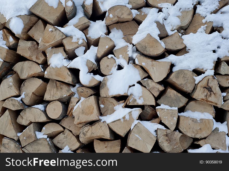 A pile of firewood chopped up in the winter. A pile of firewood chopped up in the winter.