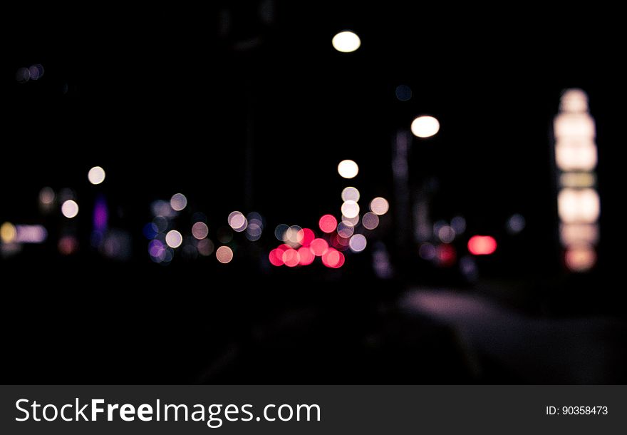 Bokeh lights in city street at night.
