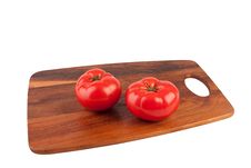 Two Tomatoes On Cutting Board Stock Photos
