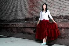 A Girl Wearing A Red Skirt Royalty Free Stock Photo
