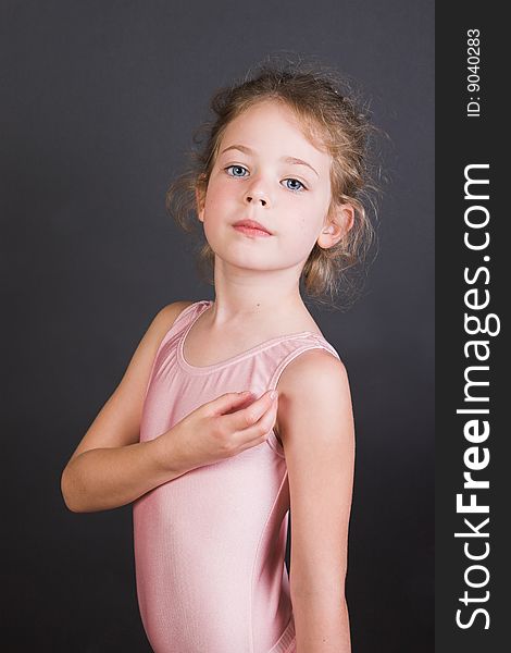 Young ballet dancer wearing an leotard and skirt. Young ballet dancer wearing an leotard and skirt