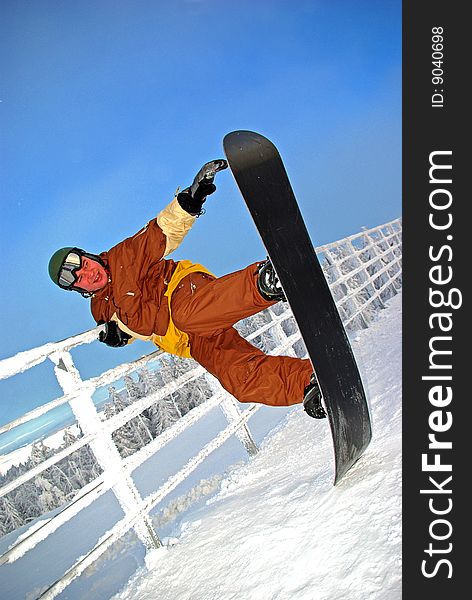 Snowboarder funning on the top of slope
