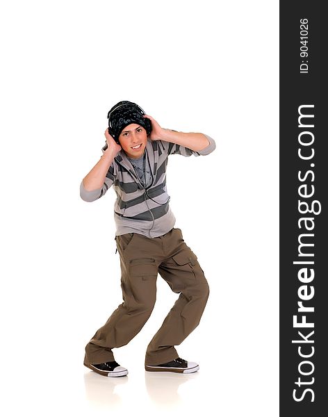 Handsome male hip hop youngster with headphones, studio shot. Handsome male hip hop youngster with headphones, studio shot