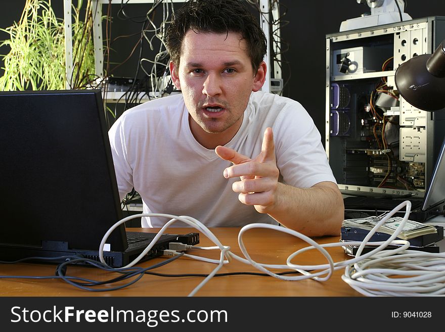 Man working on computer in the repair plant