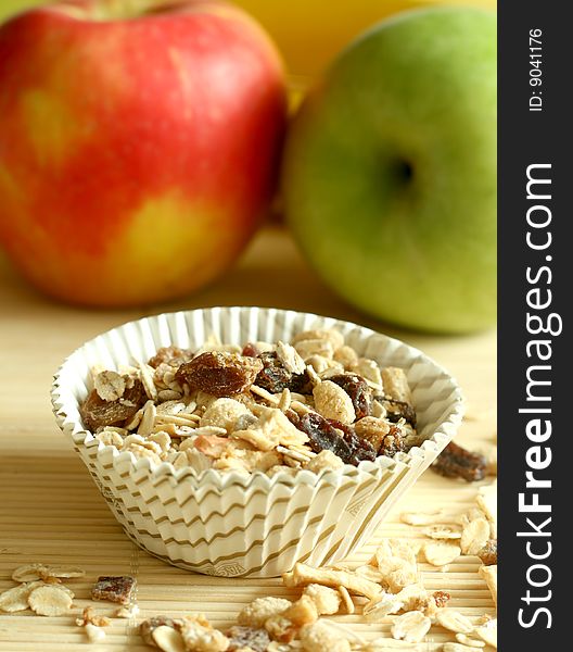 Muesli and green and red apples, breakfast. Muesli and green and red apples, breakfast