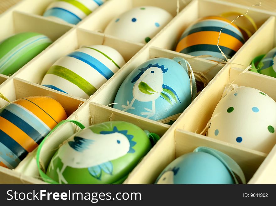 Easter eggs with ornament in a wooden box