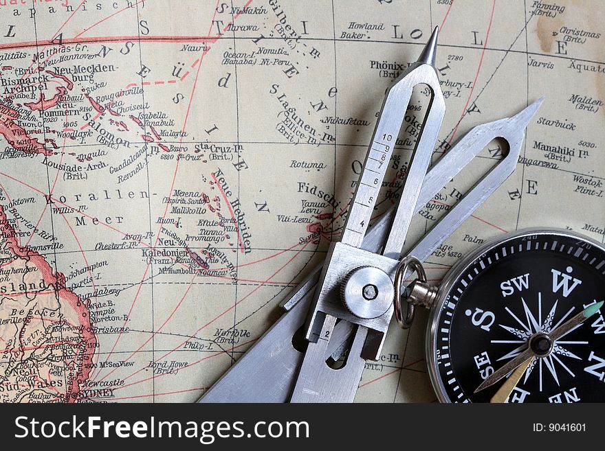 Proportional Dividers and compass on background with old map. Proportional Dividers and compass on background with old map