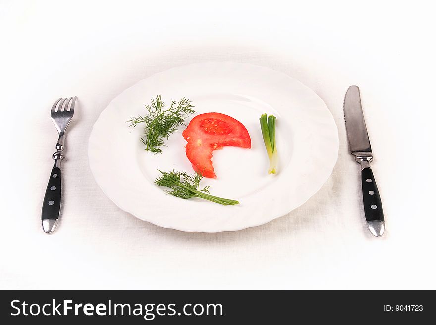 Tomato, dill and spring onion on plate. Isolated. Tomato, dill and spring onion on plate. Isolated.