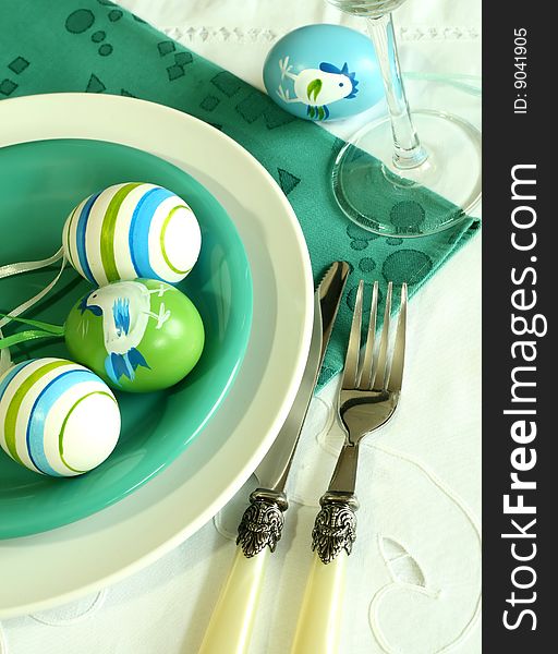 Plate, knife, fork, napkin and easter eggs. Plate, knife, fork, napkin and easter eggs