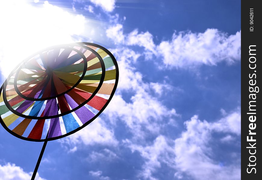 Beautiful toy rainbow on background blue sky. Beautiful toy rainbow on background blue sky