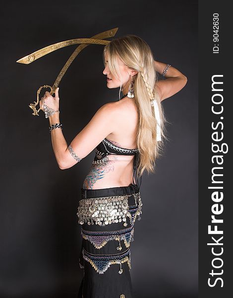 Belly Dancer hands holding two tribal swords