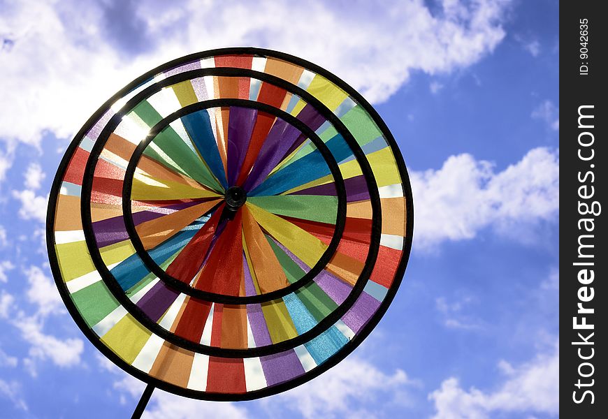 Beautiful toy rainbow on background blue sky. Beautiful toy rainbow on background blue sky