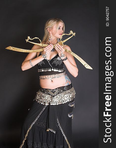 Belly Dancer hands holding traditional tribal swords