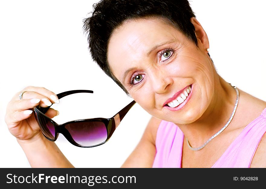 Mature woman with sunglasses on white background