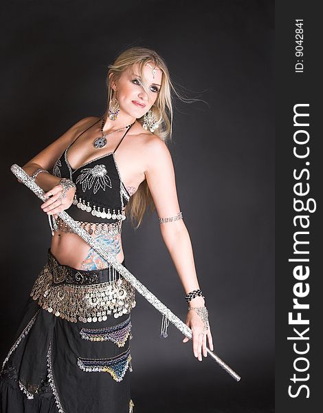 Belly Dancer hands holding a silver decorated tribal cane