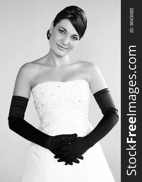 Beautiful Bride in a white dress with fancy gloves. Beautiful Bride in a white dress with fancy gloves