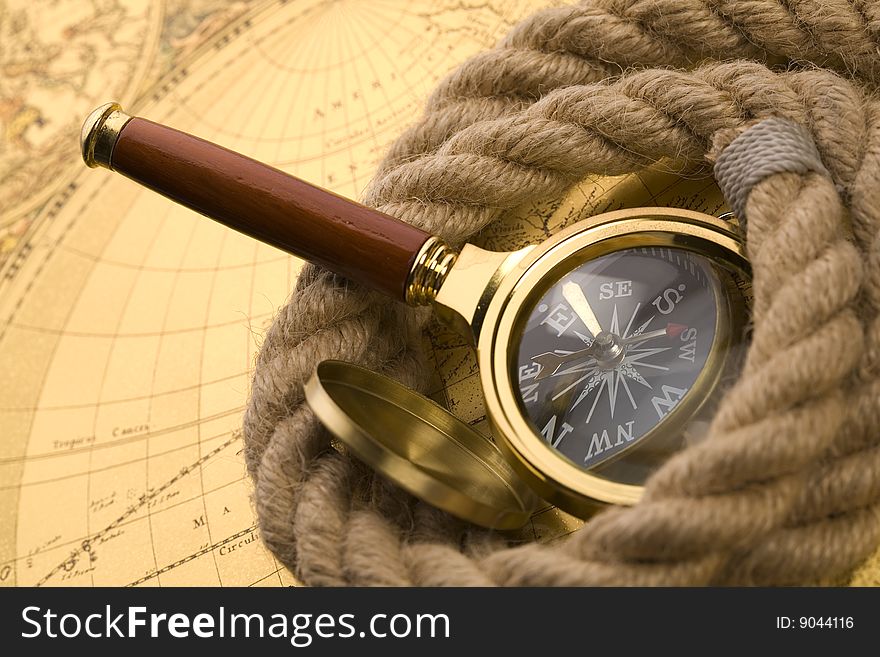 Old compass and magnifier