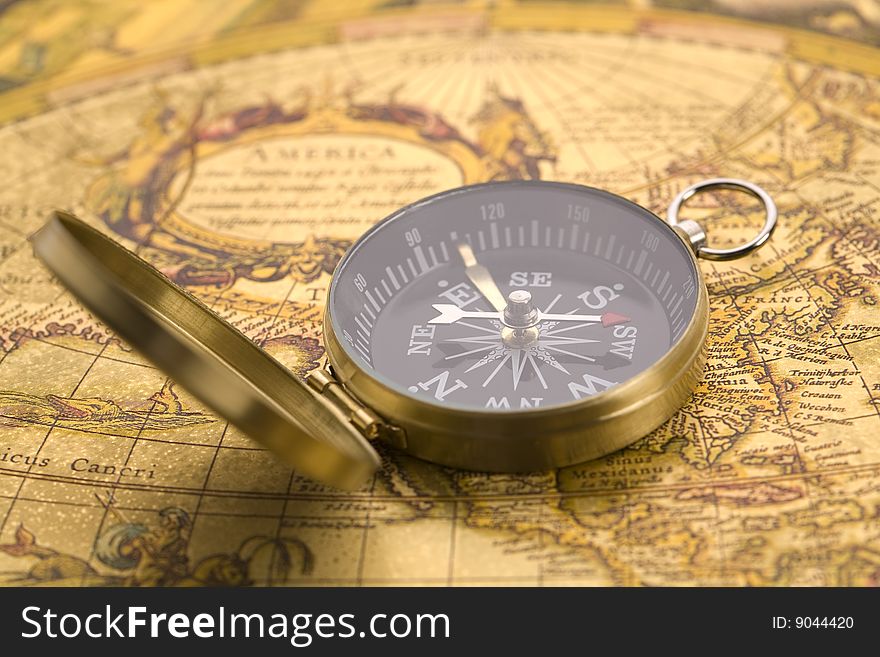 A beautiful old compass on an old map