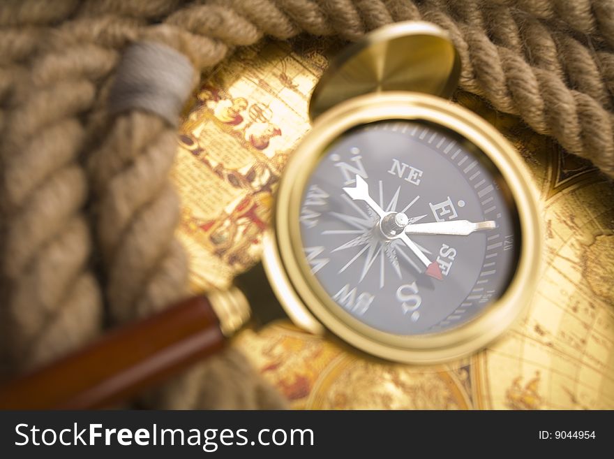 Old compass and magnifier