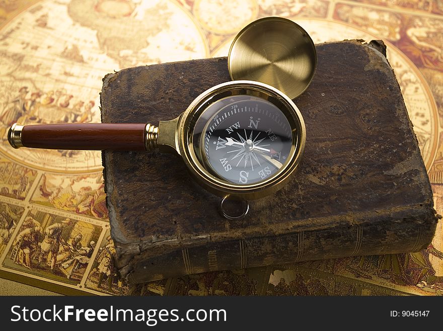 Old compass and book