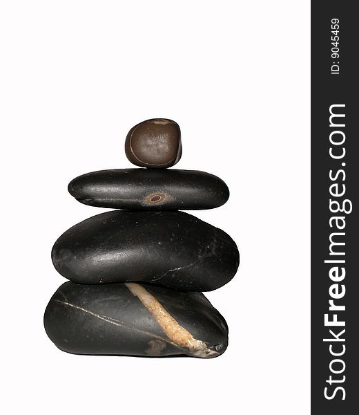 Sea pebble, stones big and small, black, brown, stones on the white background, four stones.