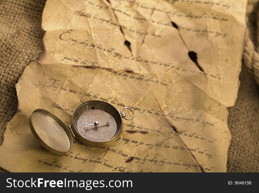 A beautiful old compass on an old letter