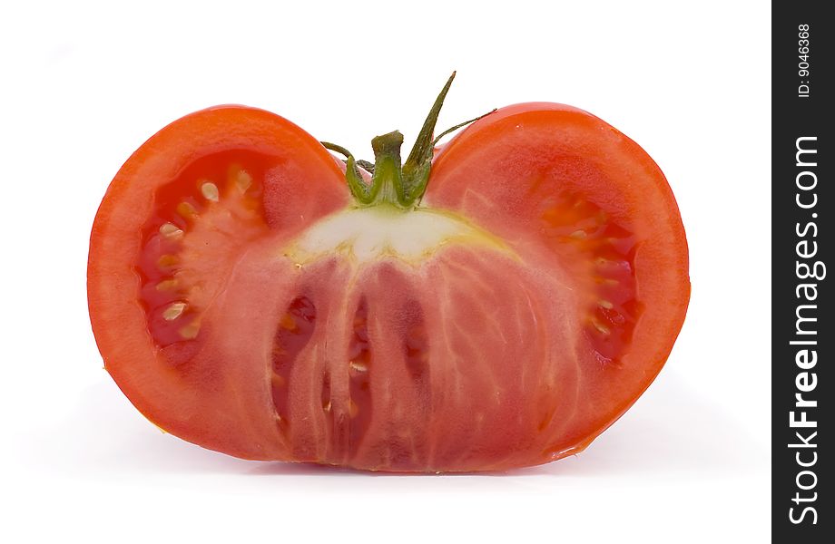 Cut red tomato  isolated on white background