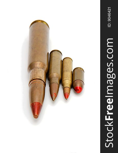 Four red-tipped tracer cartridges of various calibers isolated