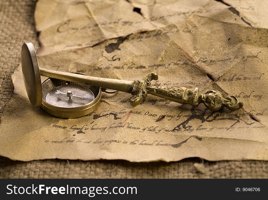 A beautiful old compass on an old letter