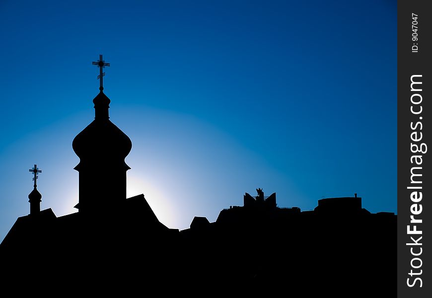 Dark silhouettes of orthodox cathedral against blue skies. Dark silhouettes of orthodox cathedral against blue skies