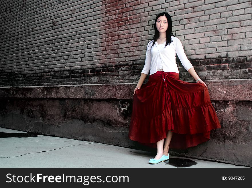 A girl wearing a red skirt