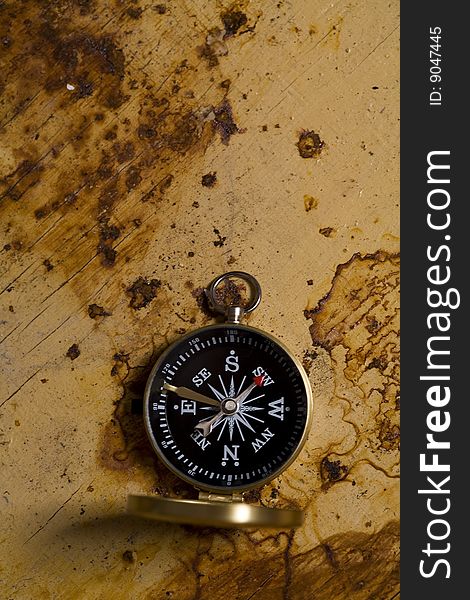 A beautiful old compass on old background