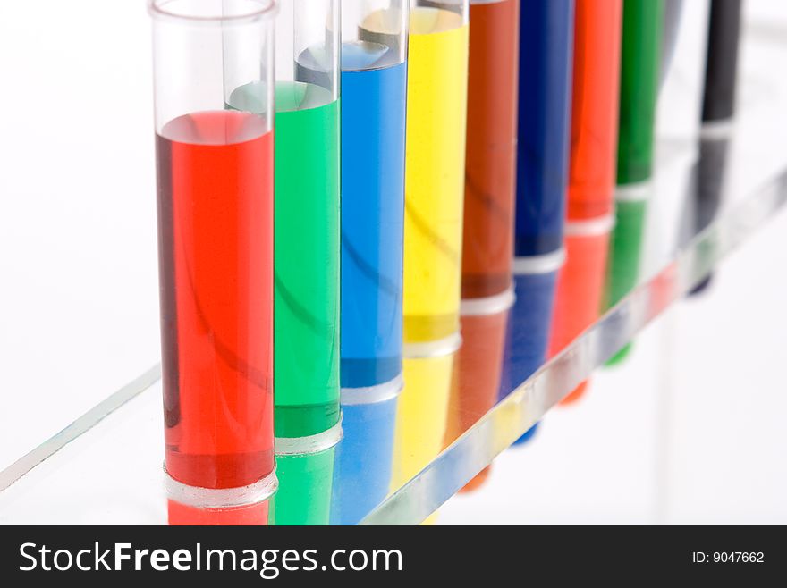 Test tube with colored water on white background. Test tube with colored water on white background